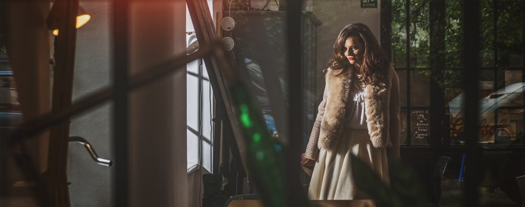A model showcasing a luxury short jacket from the A&A Vesa 2015-2016 fur clothes collection.