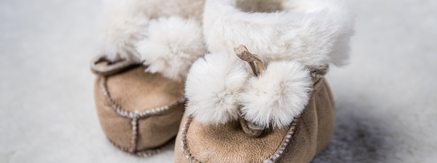 Close-up of the soft interior of A&A Vesa shearling slippers for kids.