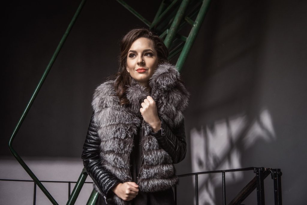 Woman wearing a voluminous fox fur jacket