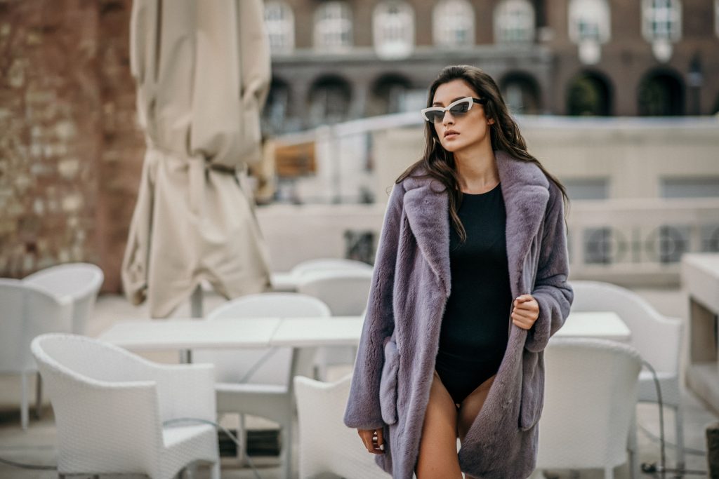 Woman wearing a grey women mink coat fur