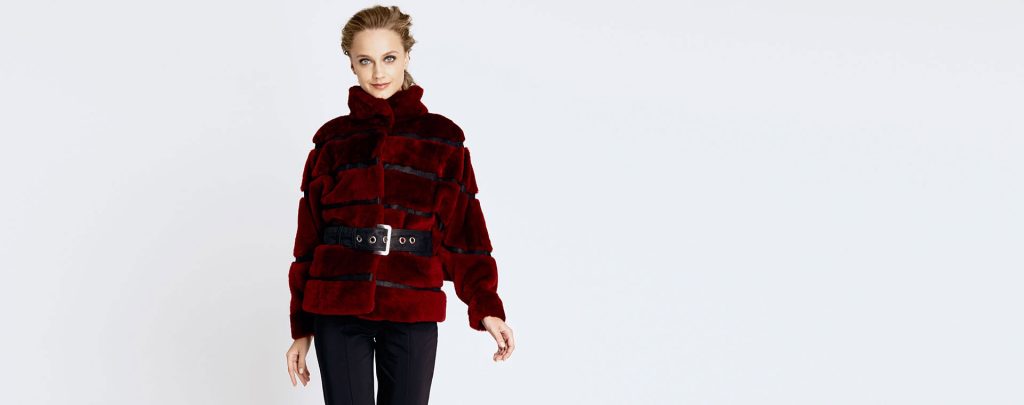 A modern women shearling coat featuring contemporary tailoring and natural textures.