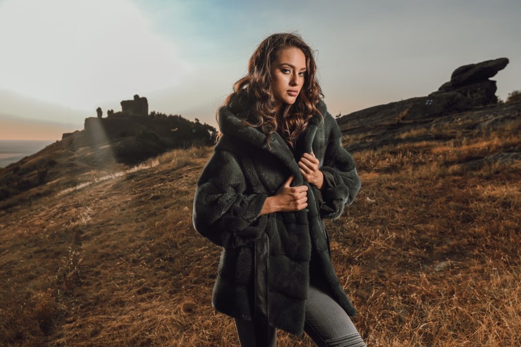 Luxury natural fur mink coats wear by a women in a nature