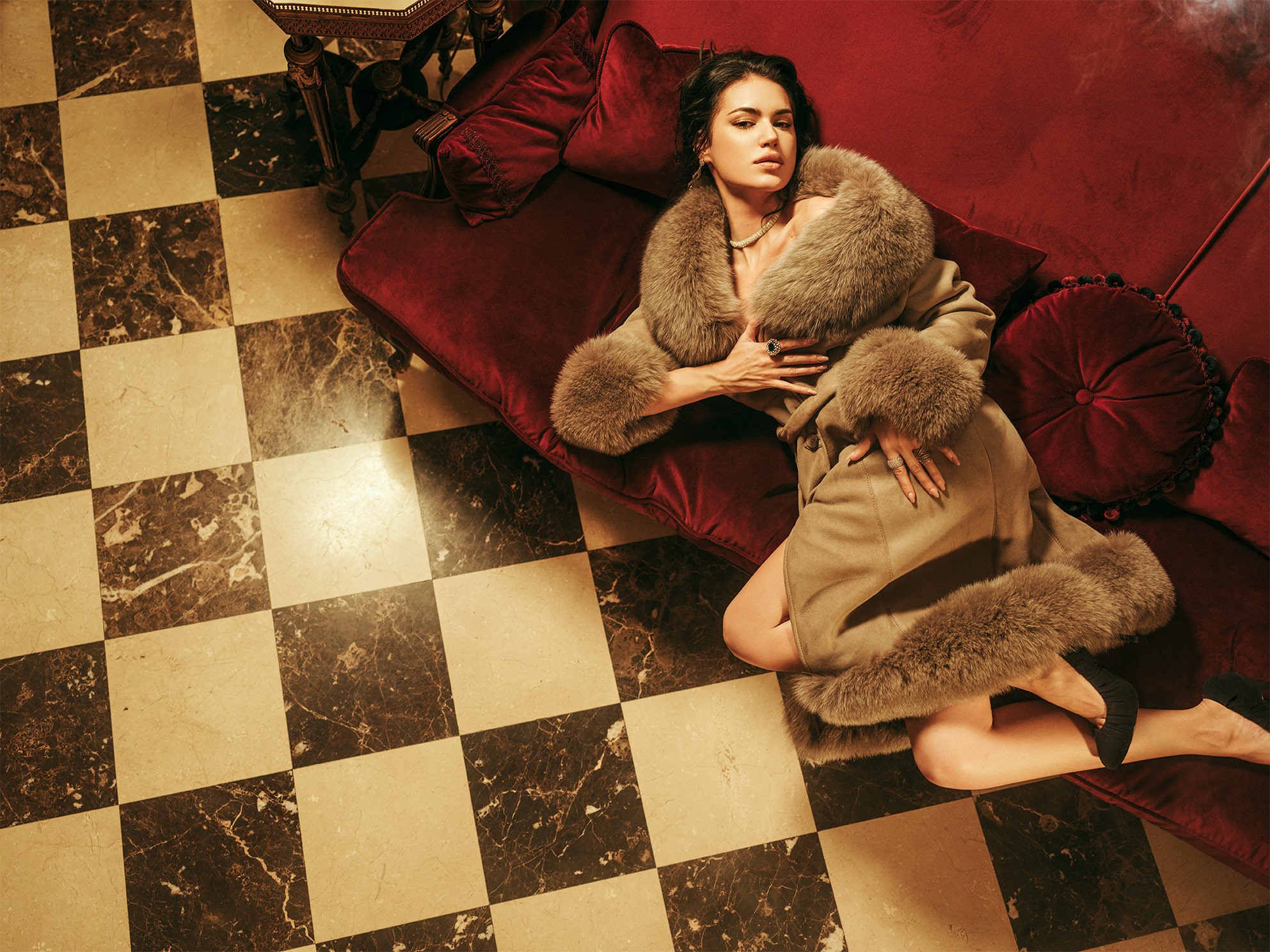 Elegant woman wearing a luxury natural fur coat