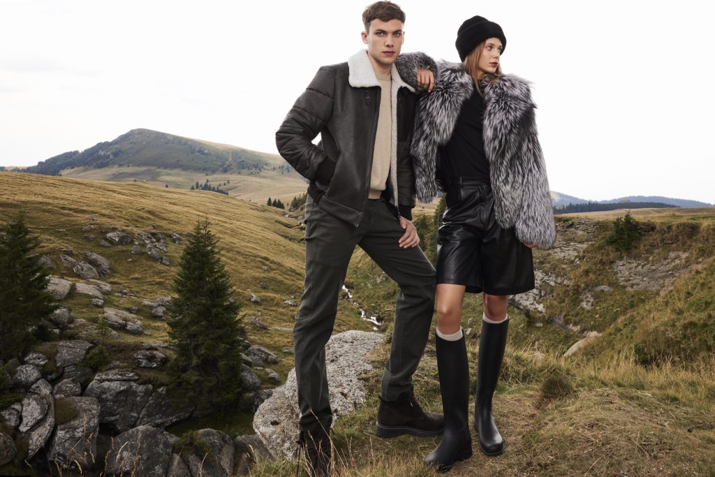 A stunning silver fox fur coat for women and a shearling jacket for men in nature, A&A Vesa 2024-2025 collection.