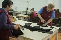 Workers trimming shearling
